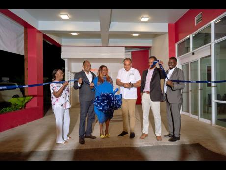 From left: Elaine Bradley-Allen, president of the Negril Chamber of Commerce; Dr Dale Foster and his wife, Dr Sonja King Foster, proprietors of Omega Medical Hospital; Dr Christopher Tufton, minister of health and wellness; Dr Carey Wallace, executive dire