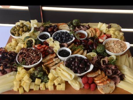 A mix of parmasean cheese, anchovies, cherry tomatoes, strawberries, blueberries, olives, mushrooms, croutons, nuts and gourmet meats provided a healthy option for clients.