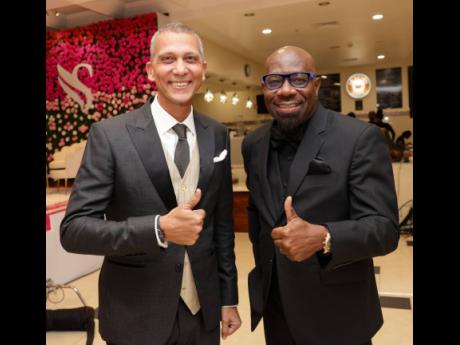 We got thumbs up from Sagicor Group Jamaica’s Chairman Peter Melhado (left), and Executive Vice-President, Shared Services, Karl Williams.