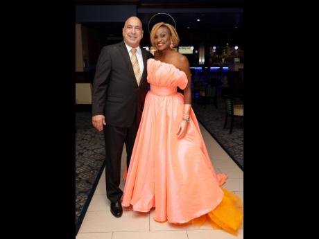 President and CEO of Sagicor Group Jamaica Chris Zacca was all smiles with the host of the event, Jennifer ‘Jenny Jenny’ Small, who was wearing Norma Williams’ Branded.