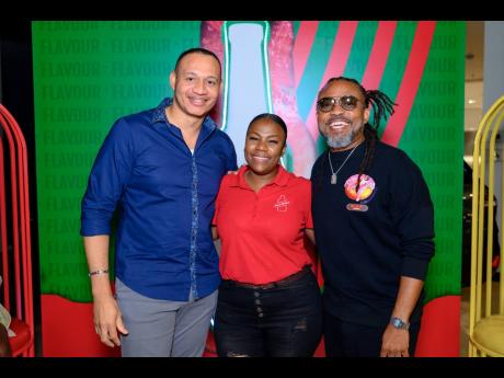 From left: JMMB Country Corporate Client Partnership Officer Alwayne Cousins; Red Stripe Flavours Brand Manager Jodi-Ann Campbell and soca king Machel Montano enjoyed the party vibes at the Wi Fete Lyme.