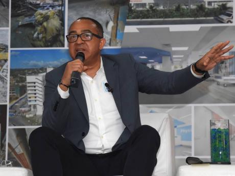 Dr Christopher Tufton, health and wellness minister, addresses the audience during a town hall meeting to provide an update on restoration work being done on the Cornwall Regional Hospital in St James. 