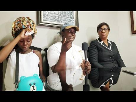 Shanastascia Crooks (left), baby mother of Jevaughn Smith; his cousin, Lateisha Crooks (centre) and attorney Tamara Francis Riley-Dunn held a press conference yesterday to highlight concerns they have in the wake of the death of Crooks.