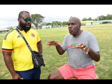 PHOTOS BY Rudolph Brown/Photographer
Coaches Bert Cameron (right) and Keilando Goburn exchange ideas during a team training session at St Jago High School in St Catherine on Friday.