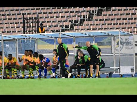 Gladstone Taylor/Multimedia Photo Editor
Reggae Boyz head coach Heimir Hallgrimsson (fifth right) watches from the touch line during their recent practice match against Trinidad and Tobago at the National Stadium. Jamaica’s senior men’s football team f
