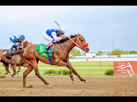 
EMPEROROFTHECATS (right) ridden by Ramon Nepare wins the Linval McFarlane, a three-year-old and upwards Open allowance race at Caymanas Park on Saturday.