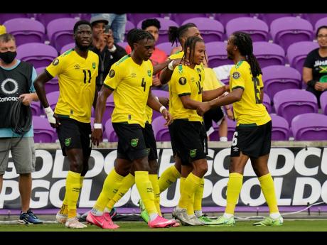 Jamaica forward Bobby Reid, second from right, scored the opener in tonight's Concacaf Nations League game against Mexico inside the Estadio Azteca.