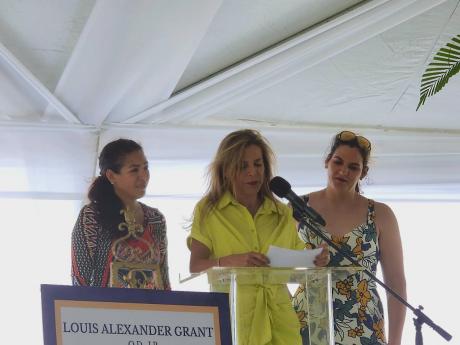Widow Debbie Grant (centre) pays tribute to her late husband Louis Grant. Her daughters Ali Peterson (left) and Bianca Underwood lend her moral support. 