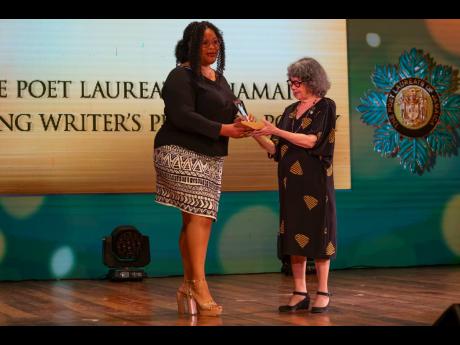 Poet Laureate of Jamaica Olive Senior (right) awards Jenelle Samuels with the Poet Laureate of Jamaica prize. 