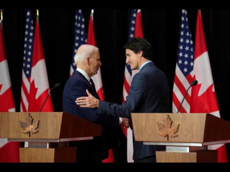 United States President Joe Biden (left) and Canada’s Prime Minister Justin Trudeau following a joint news conference in Ottawa, Ontario, on Friday, March 24.