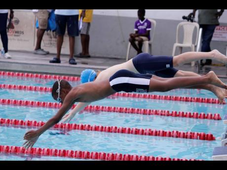 Athletes dive in to get the action going in an event at the Mayberry Investments Swim Meet at the National Aquatic Centre at the weekend. 