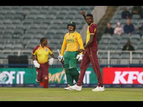 Alzarri Joseph raises his hand in celebration after taking one of five wickets during the third T20 International against South Africa in Johannesburg yesterday. 