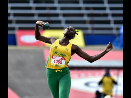 St Jago’s Kimeka Smith is about to heave the shot put to 15.82 metres, which enabled her to win the Class Two girls’ title at the ISSA/GraceKennedy Boys and Girls’ Championships at the National Stadium today.