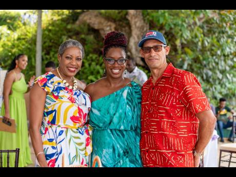 Aisha Campbell (centre), CEO, PROVEN Properties, shares some lens time at their St Ann Takeover event with Peter and Andrea Cowan, CEOS of Lillian Ltd.