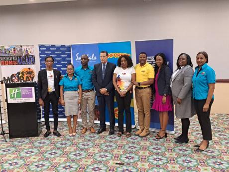  Janet Silvera (centre), chairman of the Courts MoBay City Run Organising Committee, in a group shot alongside Homer Davis (fourth from left), minister of state in the Office of the Prime Minister West; Emerson Whittley (third from left), the Courts MoBay 