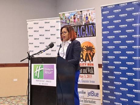Simone Mahabeer, brand manager at Courts Jamaica, addresses the press launch of the MoBay City Run’s seventh annual staging.