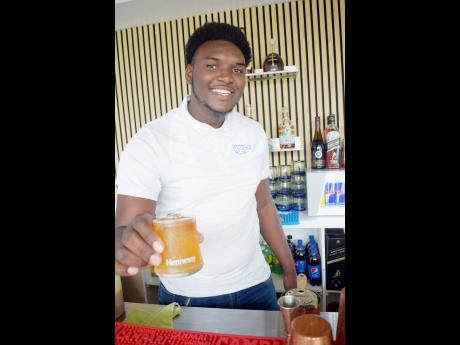 Mixologist Conroy Plummer’s personality shines in both the presentation and taste of his drinks. 