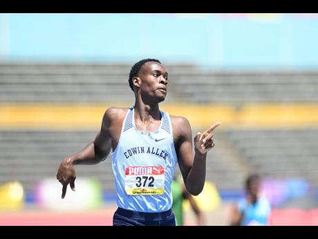 Edwin Allen’s Delano Kennedy strolls to a win in the semi-finals of the 400 metres at the ISSA/GraceKennedy Boys and Girls’ Athletics Championships inside the National Stadium yesterday.