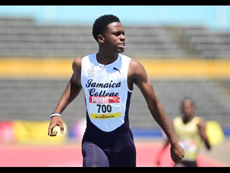 Jamaica College's Malique Smith Band on his way to winning semifinal one of the ISSA/GraceKennedy Boys and Girls' Athletics Championships Boys' Class I 400 metres inside the National Stadium yesterday. 