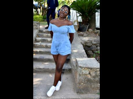 Rachel Francis was festival comfortable in a denim romper and white low tops. 