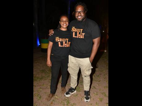 Hard at work, Jamaica Film and Television Association (JAFTA) President Saeed Thomas (right) and Lesley Ann Wanliss, business development and initiatives chairperson, JAFTA, posed for a quick picture.