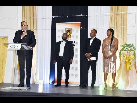 From left; past student and Minister of Health and Wellness, Dr Christopher Tufton, with past student and donor Clive Wint, board member, past student and donor Dr Carl Bruce, and past student and donor Simone Scarlett during the launch of the Manchester H