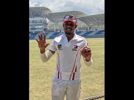 Trinidad & Tobago Red Force medium pacer Tion Webster shows how many wickets he got against the Jamaica Scorpions following day two action in their West Indies Championship match at the Brian Lara Cricket Academy yesterday. 