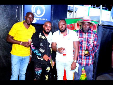 Black Magic Sound was victorious in their preliminary clash round. From left: event execution analyst, JWN, Tesfaye Brown; Kurt Mullings from Black Magic Sound; Magnum All-Star Sound Clash promoter, Cheiftin Campbell; and Maynard Smith of Black Magic Sound