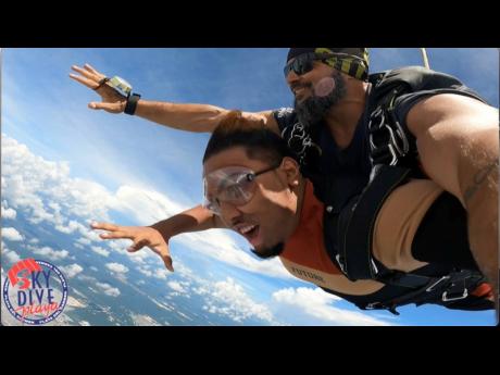 Tomlinson enjoyed the tandem skydive experience in Cancun, Mexico.