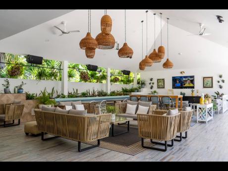 The beautiful pool lounge incorporates a number of Jamaican wicker fixtures.