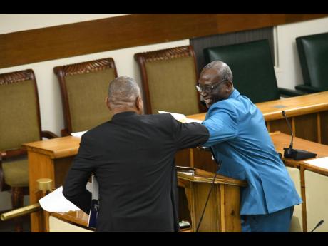 In this 2020 file photo, PNP’s Horace Dalley (left) and JLP’s Desmond McKenzie engage in friendly banter. Dalley says most members of parliament on both sides of the aisle enjoy a good relationship.