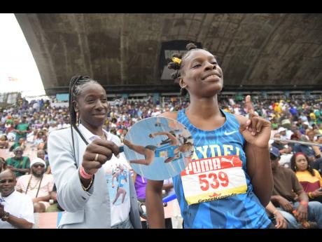 
Double sprint champion Alana Reid celebrates her girls’ 200-metre title with her ever-present mother, Kerry-Ann Chisholm, after the event at the ISSA/GraceKennedy Boys and Girls’ Athletics Championships inside the National Stadium yesterday.