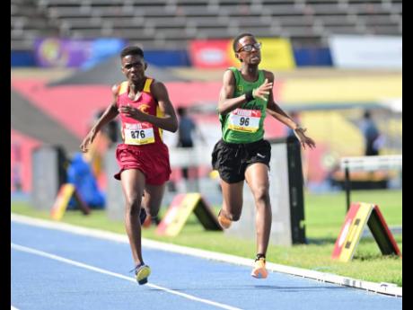 Carlos Brison-Caines (right) of Calabar High battles with Maggotty High School’s Jayden Brown to the finish in the Class Three boys’ 1500 metres final last Wednesday. Brison-Caines won in  4:18.18  and Brown was second in  4:18.26.  