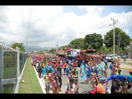 Revellers marching along the Xodus Jamaica carnival route in April 2019