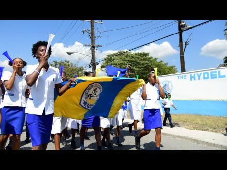 Students from the Hydel Group of Schools celebrating their historic triumph at last week’s ISSA/GraceKennedy Boys and Girls’ Championships at the school in Ferry, St Catherine yesterday. Hydel won the girls’ title for the first time with 279 points, 