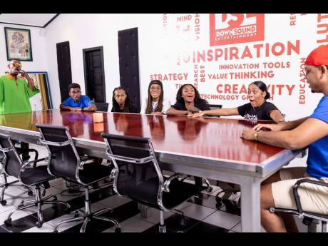 Host of The Social House JA, Rushane ‘Rush Cam’ Campbell (left) explains the upcoming challenge to all the influencers.