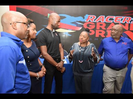 Minister of Culture, Gender, Entertainment, and Sports, Olivia Grange, had the attention of from left: Milton Walker, group head of news and sports, RJRGLEANER Communications Group, Carlene Edwards, promotions and sponsorhsip head at JN Group, Andrei Roper