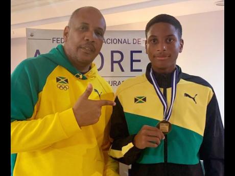 (Crop to) Jaden Shaw displaying the 2022 CAC Under-16 gold medal he won in Tegucigalpa, Honduras. 