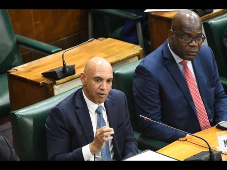 Police Commissioner Major General Antony Anderson (left) and Deputy Commissioner of Police Fitz Bailey appearing before the Internal and External Affairs Committee of Parliament on Tuesday.