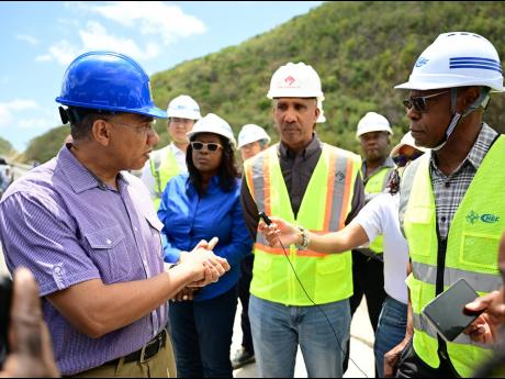 From left: Prime Minister Andrew Holness addresses journalists during a tour of the St Thomas leg of the Southern Coastal Highway Improvement Project on Thursday. Looking on are Audrey Sewell, permanent secretary in the Office of the Prime Minister; Andrew