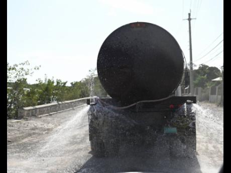 Prime Minister Andrew Holness said that there would be more wetting of the surface to reduce the dust nuisance as work continues on the highway.
