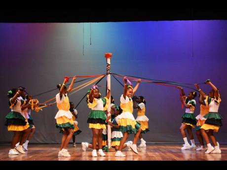 Children from the St Theresa Perparatory School performing the maypole at the JCDC Festival of the Performing Arts.