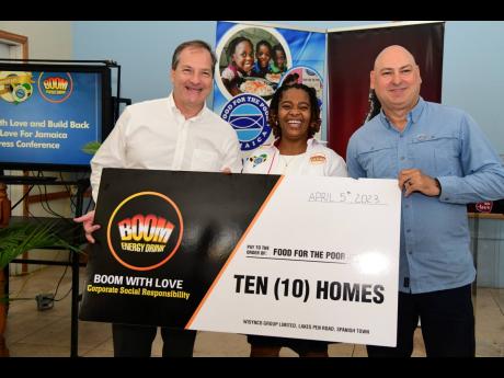 From left: Francois Chalifour, director of marketing at Wisynco Group, presents a symbolic cheque to Kavette Silvera and Craig Moss-Solomon, executive directors of Food for the Poor, Jamaica, during a small launch ceremony earlier this month.