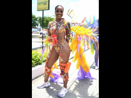 Always stunning, our lens caught Suelle Anglin enjoying the soca music while jumping with GenXS.