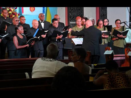 Winston Ewart conducting the National Chorale of Jamaica at its service celebrating 50 years of excellence in music of adoration at the Holy Cross Church in Half Way Tree, St Andrew, in November 2022.