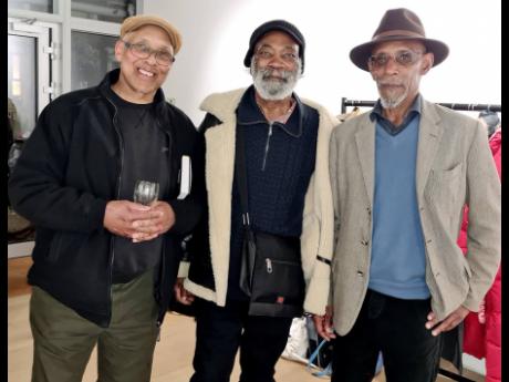 Linton Kwesi Johnson (right) is joined by musician John Kpiaye (left) from the Dub Band and singer/musician Dennis Bovell at the launch of the book ‘Time Come:  Selected Prose’ inside the 198 Art Gallery  in Brixton, south London.