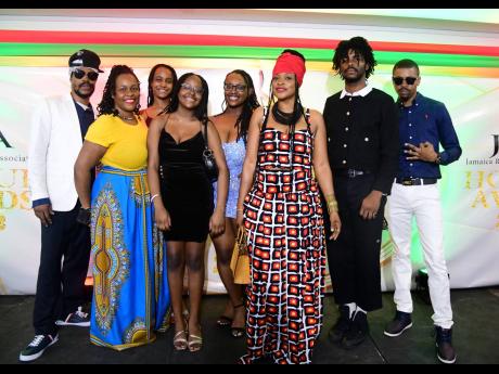 Pashon Minott (front) and her siblings, nieces and nephews at the JaRIA awards ceremony at the Jamaica Conference Centre on Monday, April 10.