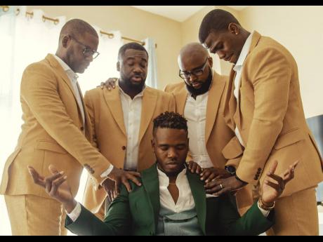 The groom, Kemoi Burke, and his groomsmen, Andre Moulton, Chad-Anthony Smart, Craig Nicholson, and Dr Jason Strachan gather in the presence of God.  