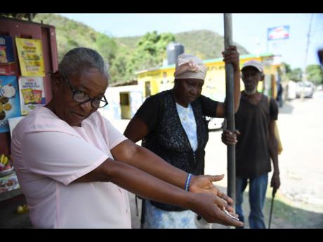 Pensioners Lurline Jackson, 69; Clarissa Brown, 67; and Ainsley Malcolm, 72, say the closure of the demolition of the post office in Bull Bay has been causing distress for elderly residents in the community.