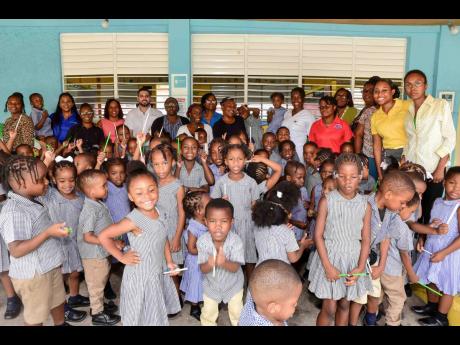 Students, the Hospiten team, and the entire school staff gather for photos after the handover ceremony for the refurbished sick bay at the Cornwall Gardens Basic School.